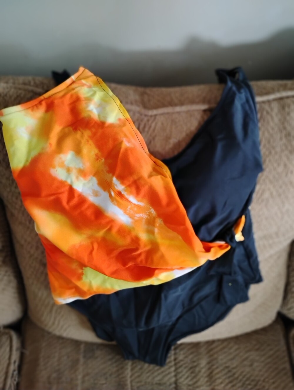 Black One-Piece Swimsuit with Orange Tie-Dye Cover up that ties at the side